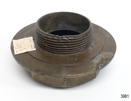 Hollow nut has damaged screw thread on short shaft. A white sticker is attached.
