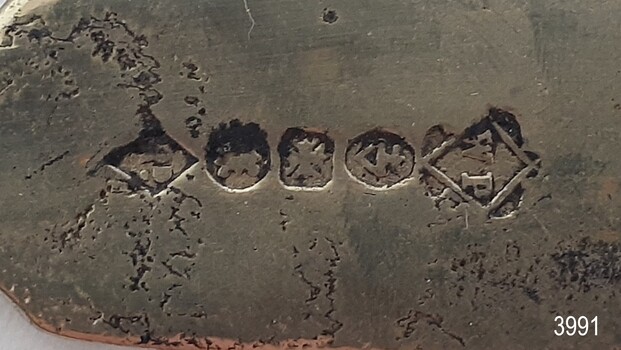 Maker's Marks are impressed on the back okf the handle