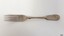 Silver metal fork has collar and decorative handle