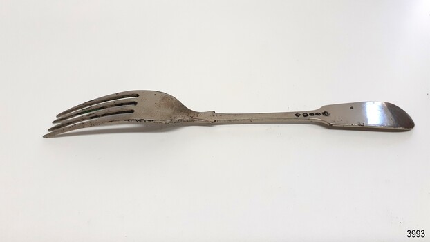 Maker's marks have been impressed into the handle