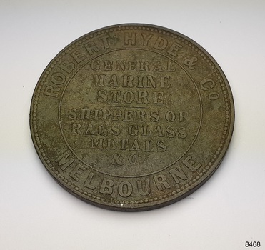 Reverse of coin has text around the circumstance and in the centre