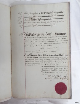 Handwritten page with red seal, stamped, at the foot of the page