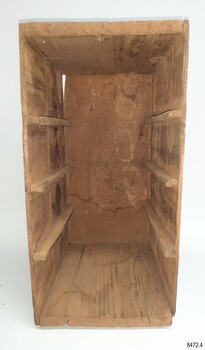 Wooden drawer frame has three sets of rails on which the drawers slide, allowing for four drawers