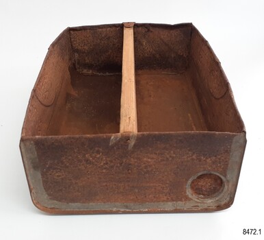 Tin drawer has wooden divider in centre. Pouring hole in tin has been closed.