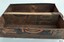 Drawer's side is black with orange text, wooden divider also has impressed text