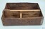 Metal drawer has two wooden dividers, making three compartments. Inscriptions are impressed into the din.
