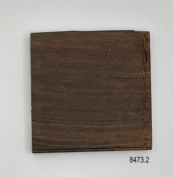 Reverse has a prominent grain and two edges are indented.