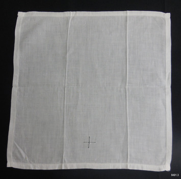 Square hemmed white cloth with drawn-thread emblem of a cross