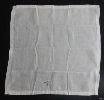 Square white fabric with drawn-thread design of a cross
