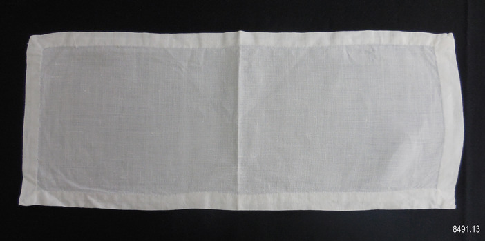 Fine white linen rectangle of fabric with narrow hem