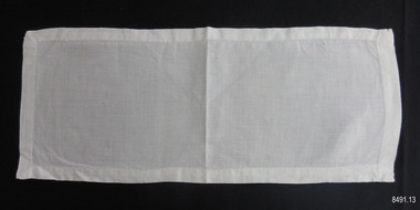 Fine white linen rectangle of fabric with narrow hem
