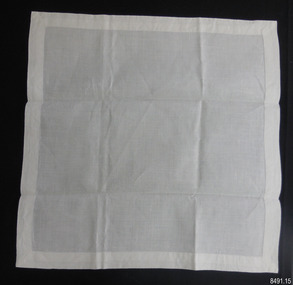 Square of fine white linen with handstitched hem