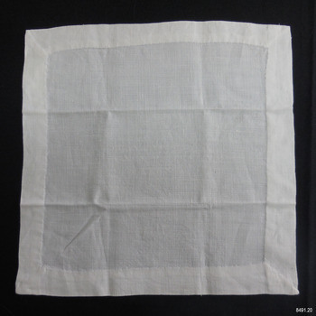 White linen square with wide hem