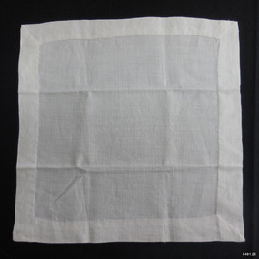 White linen square with wide hem