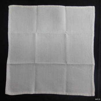 Square of white linen, hand stitched hem