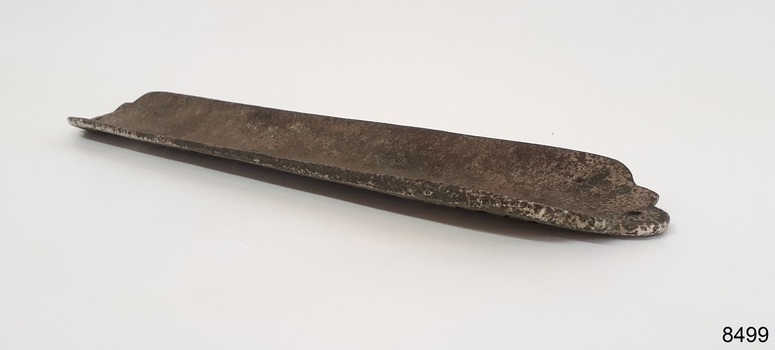 Concave rectangle has rough surface and varying thickness.