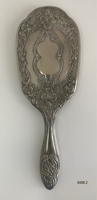 Back view of ornate hair brush