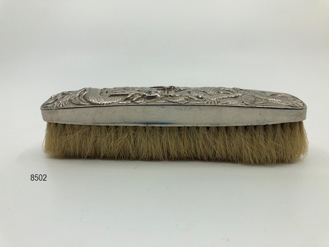 Side view of clothes brush.