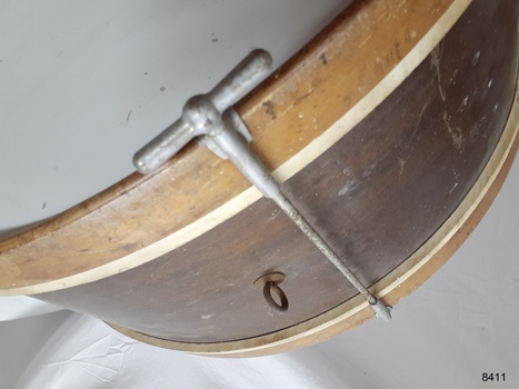 Tension rod is attached to the rim of the drumheads. It has a T shaped handle and is threaded on the end.