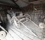 Wooden carriage, four wheels, front bench seat and rear benches along the sides. Leather upholstery.