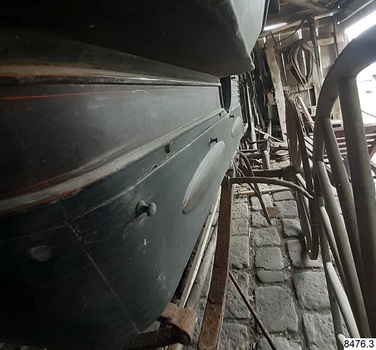 Metal buttons for attaching accessories such as a hood