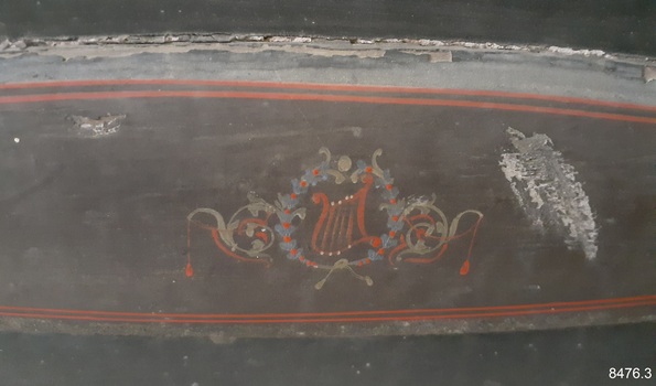 Detail of a harp within a wreath