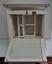 Screen's other side and back have louver panels. Inside are two white frames with screws.