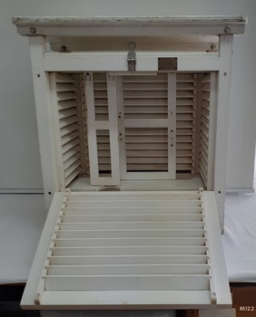 Screen's other side and back have louver panels. Inside are two white frames with screws.