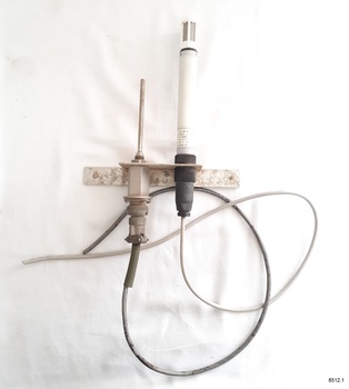 Tow electronic instruments attached to a flat metal bracket