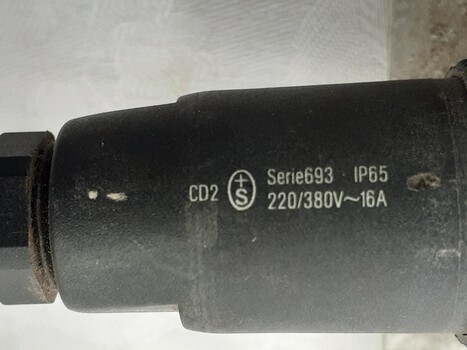 Black electrical fitting has printed inscription