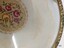 A closeup view of a section of the net embroidery in between the centre embroidery and the gilt edge of the tray.
