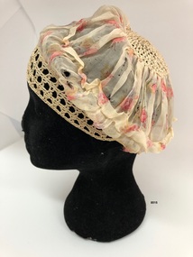 Side view of silk floral boudoir cap