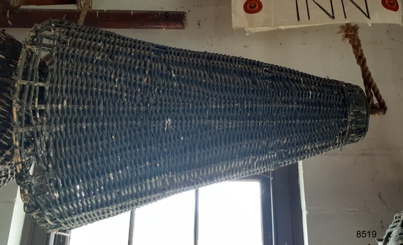 Black cane cone shaped signal with metal fittings