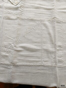 One smaller apron pocket labelled "Hairpins", one larger pocket labelled "Brush and Comb" and two narrow pockets.