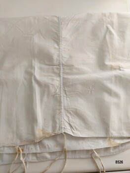 Cotton sham with ties and drawstring.