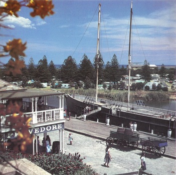 Green wagon and blue spring cart at the Flagstaff Hill wharf
