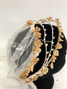 Side view of wax flower bridal headpiece