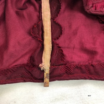 Close up view of metal stay inserted in bodice.