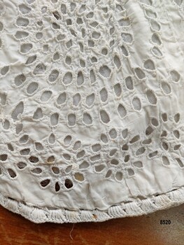 Broderie anglaise and hem embroidery on a child's white dress