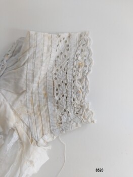 Sleeve with pintucks and broderie anglaise trim