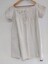 Front view of white, cotton chemise with pintucks and broderie anglaise on front bodice, neckline and sleeves