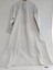 A long, white, lady's cotton nightgown decorated with pintucks and broderie anglaise
