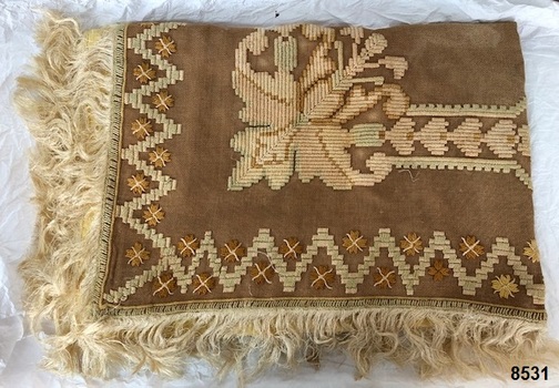 Front quarter view of fringed tablecloth