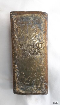 An inscription is stamped into the base