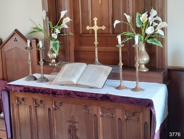 Long white cloth with hem, on altar