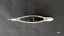 Side view of beige plastic boat shaped tatting shuttle showing the black plastic removeable bobbin inside and the enclosed ends