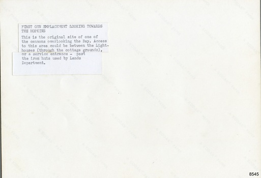 Typed label attached to back of photograph describing the scene