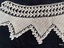 Close view of section of crochet lace to show pattern.