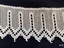 Close view of section of crochet lace to show pattern.