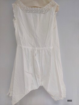 Back of lady's white, lawn combinations showing gathered waist and split legs